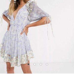 ASOS DESIGN floral printed mini dress with satin trim ruffle and tie detail